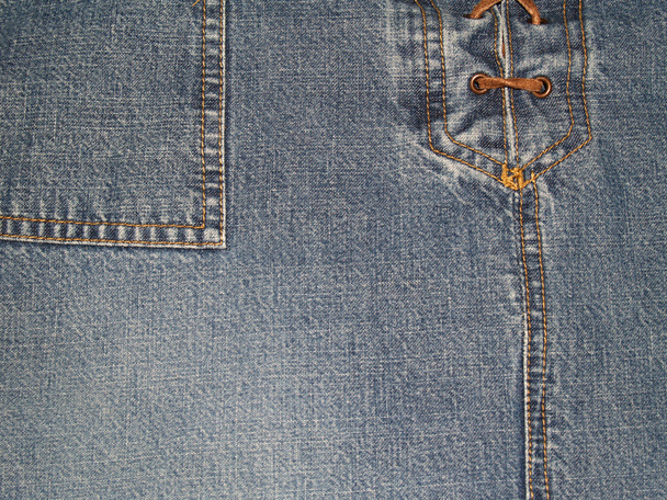 Kopiëren van ruimte op een Close-up beeld van denim broek of rok met veters van de voorkant en zak. - Foto, afbeelding