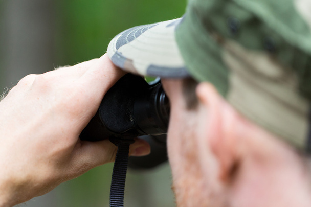 close up of soldier or hunter with binocular - Foto, afbeelding