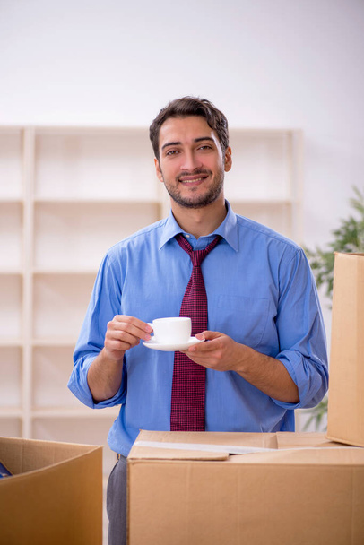 Young male employee in office relocation concept - Photo, Image