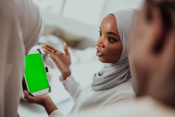 Group of happy african students having conversation and team meeting working together on homework girls wearing traidiional sudan muslim hijab fashion - Fotografie, Obrázek