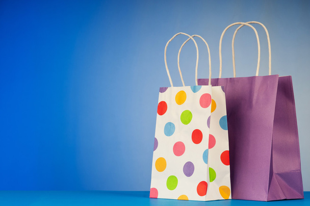 Shopping bags against gradient background - Photo, Image
