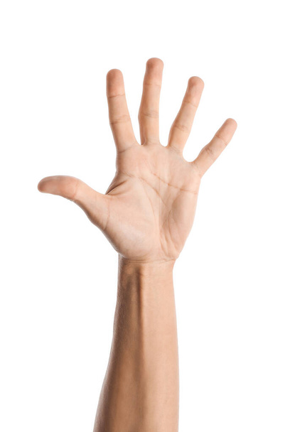 Jeune main masculine sur fond blanc - Photo, image