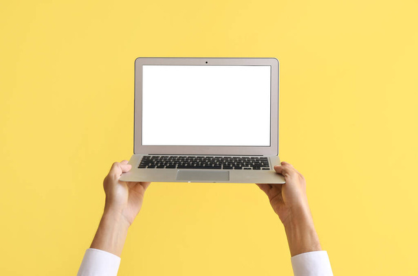 Male hands with modern laptop on color background - Zdjęcie, obraz