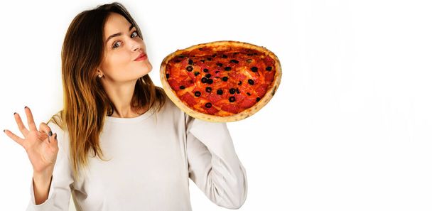 Smiling girl with pizza showing okay sign. Tasty Italian food. Fastfood. Snack. Lunch. Food delivery. - Photo, image