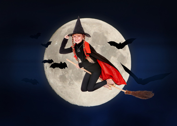 Child witch flying on broomstick - Photo, Image