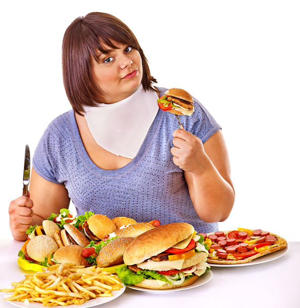 Woman eating fast food. - Photo, Image