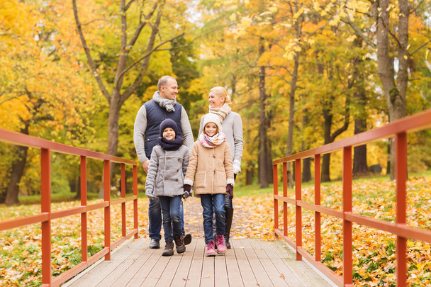 happy family in autumn park - Fotografie, Obrázek