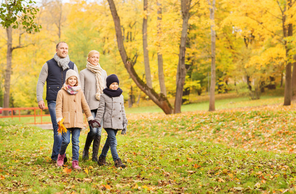 happy family in autumn park - Фото, изображение