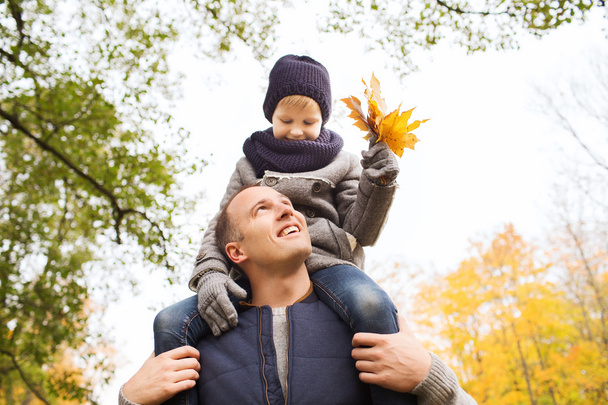 happy family having fun in autumn park - Фото, изображение