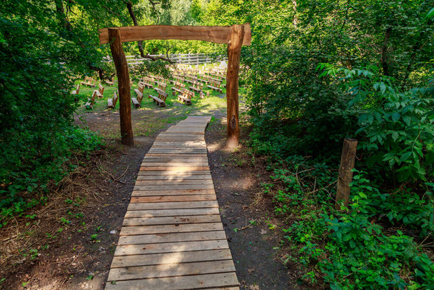 Wooden sidewalk from boards in the park. Background with copy space for text - Photo, Image