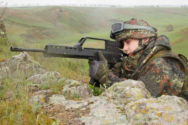 Soldier targeting with automatic rifle - Photo, Image