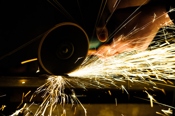 Metal grinding on steel pipe - Valokuva, kuva