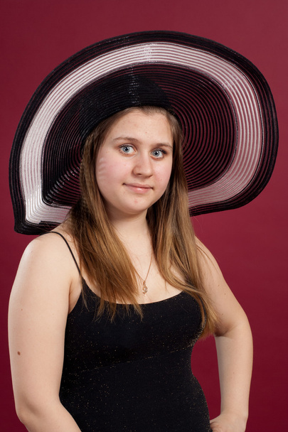Portrait of girl in dress and hat isolated - Fotó, kép