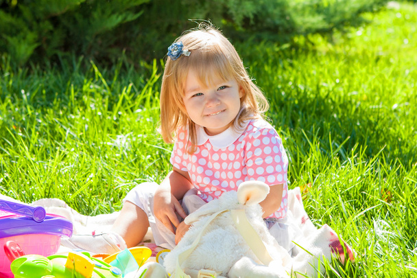 Happy little girl in the Sunny meadow - Zdjęcie, obraz