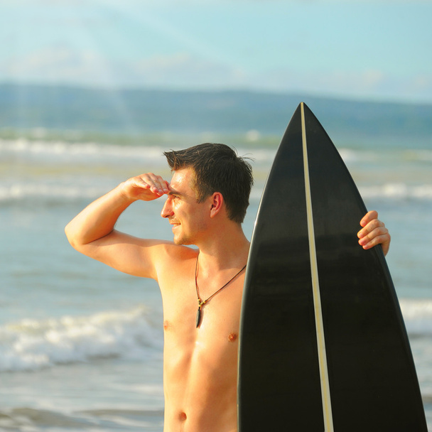 Surfer with board - Foto, afbeelding
