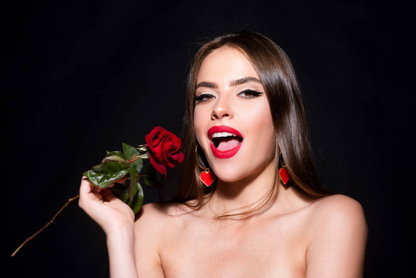 Beauty excited woman with red rose. Fashion girl face with rose in hand. Red lips. Vogue spring summer style. - Foto, Bild