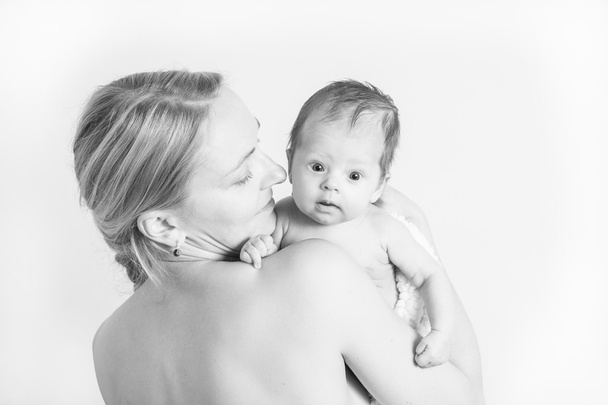 Baby girl in a mother's arms - Photo, Image