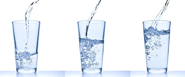 Pouring water into glass - Φωτογραφία, εικόνα