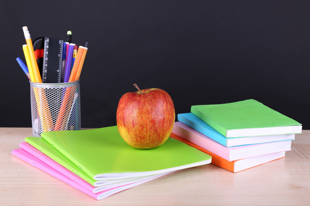 School supplies on table on dark background - Photo, Image