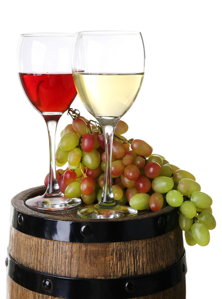 Wine in goblets and grapes on barrel isolated on white - Фото, зображення