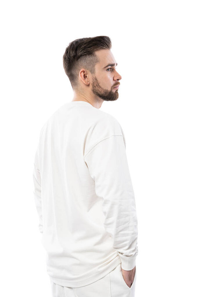 Handsome man wearing white long-sleeved t-shirt isolated on white background - Foto, imagen