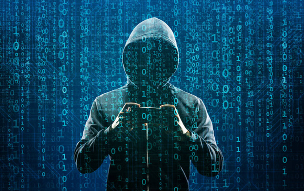 Computer Hacker in Hoodie. Obscured Dark Face. Hacker Attack, Virus Infected Software, Dark Web and Cyber Security Concept . - Foto, Imagen