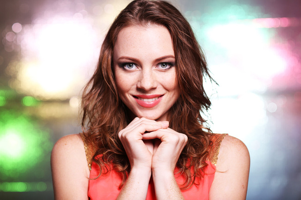 Portrait of beautiful young female on bright background - Fotografie, Obrázek