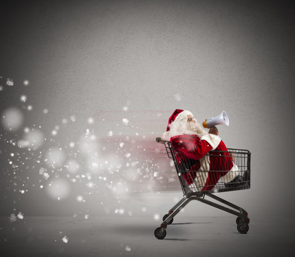 Papai Noel anúncio através de megafone
 - Foto, Imagem