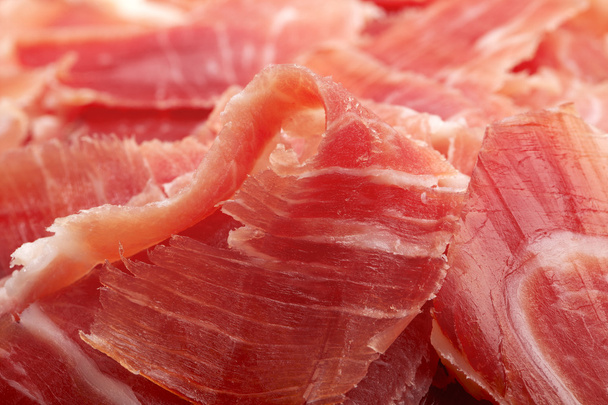 Spaanse serrano ham jamon gesneden close-up achtergrond - Foto, afbeelding