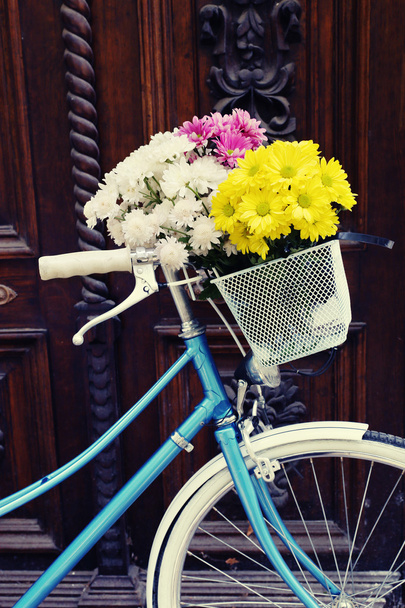 Bicycle with flowers in basket - Fotó, kép
