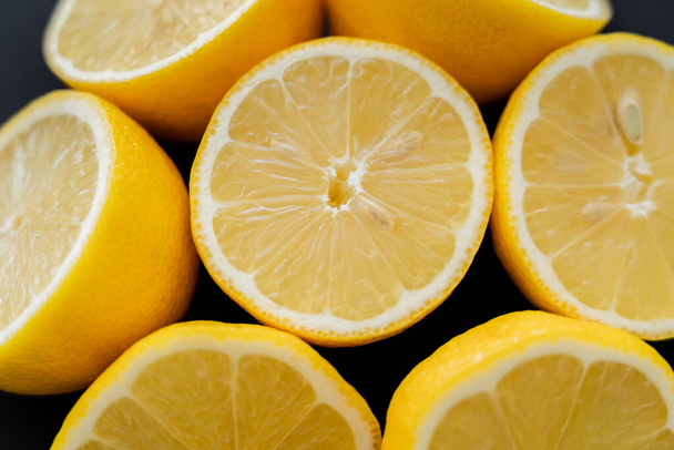 Close up view of juicy lemons isolated on black  - Фото, зображення