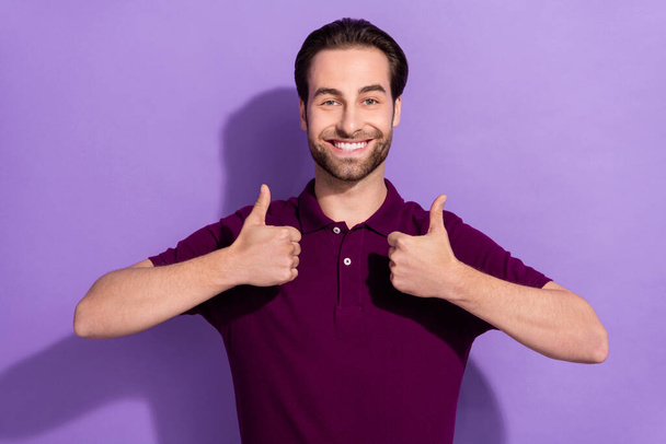 Photo of good looking male showing double thumbs up promote good quality product isolated on purple color background - Foto, Bild