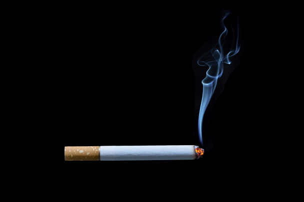 Cigarette with smoke on black background - Fotoğraf, Görsel