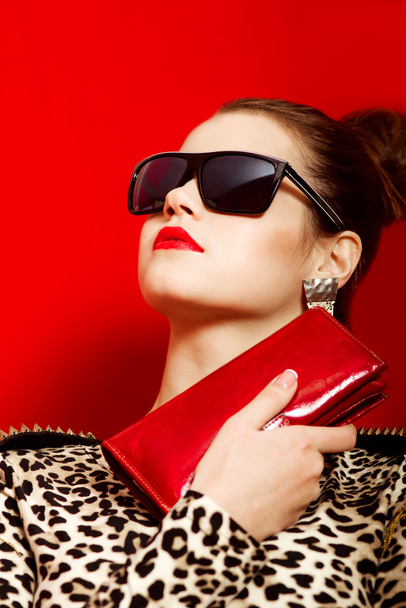 Beautiful girl in a trendy  dress and sunglasses - 写真・画像