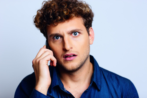 Handsome man with curly hair - 写真・画像