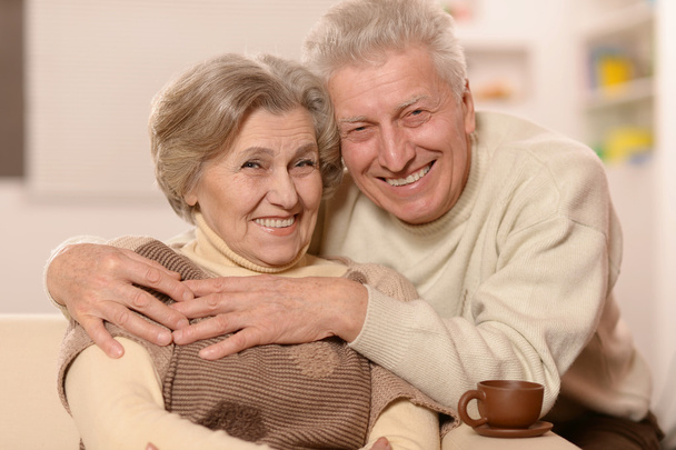 Senior couple with cup of tea - Фото, изображение