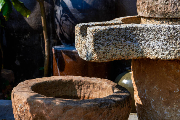 Close-up of traditional stone mill in a Chinese garden - 写真・画像