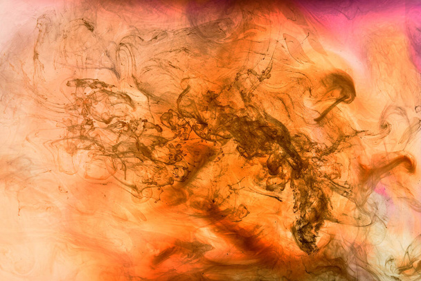 Orange pink smoke background, colorful fog, abstract swirling ink ocean sea, acrylic paint pigment underwater - Фото, зображення
