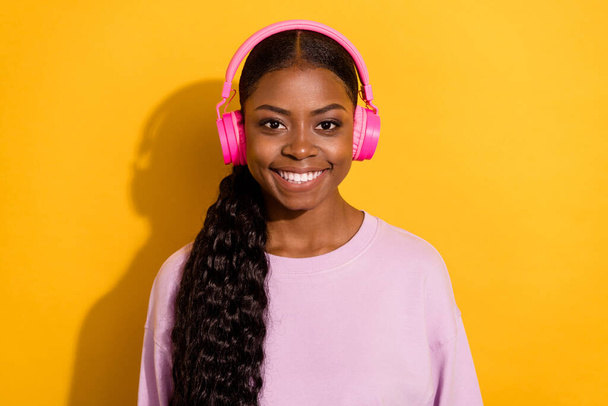 Portrait of positive friendly person enjoy listen favorite song rest relax isolated on yellow color background - Fotoğraf, Görsel