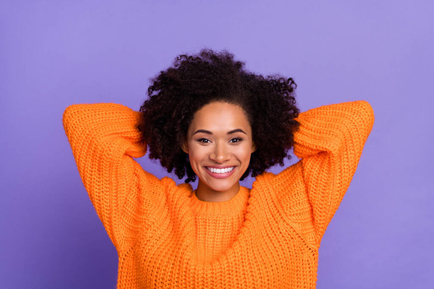 Portrait of attractive cheerful girl wearing cozy jumper resting free time isolated over bright purple violet color background - 写真・画像