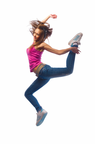 girl in headphones jumps - Foto, imagen