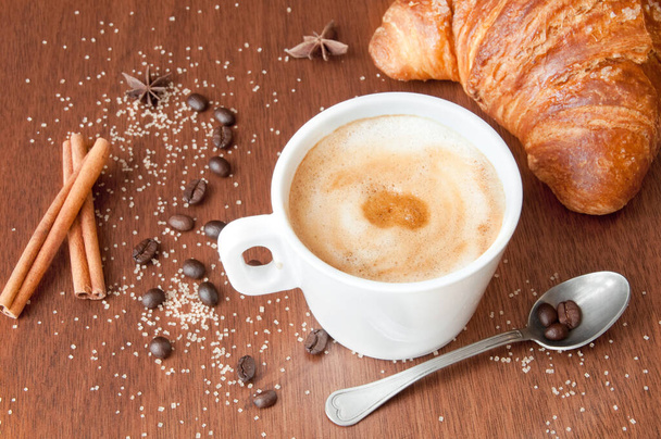 coffee with croissant and cup of hot chocolate on wooden background - Photo, Image