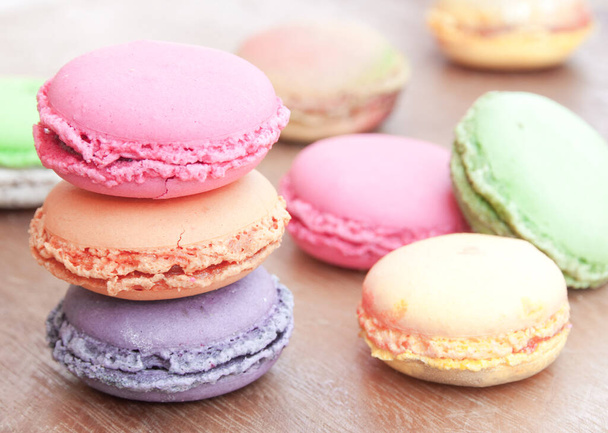 colorful macaroons on white wooden background - Photo, image