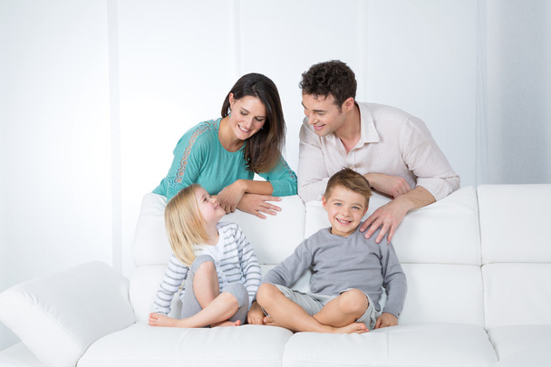cheerful family in living room - Fotoğraf, Görsel