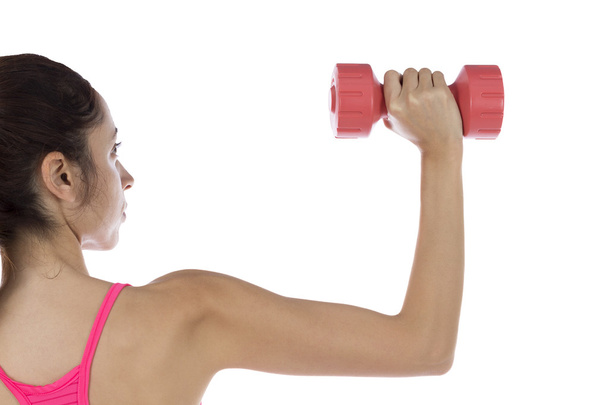 Fit woman lifting dumbbell - Photo, Image