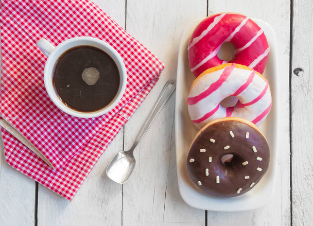 donuts with chocolate and donut on wooden background - 写真・画像