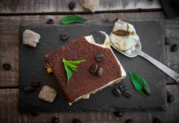chocolate cake with mint and nuts on a wooden background - Foto, Imagem