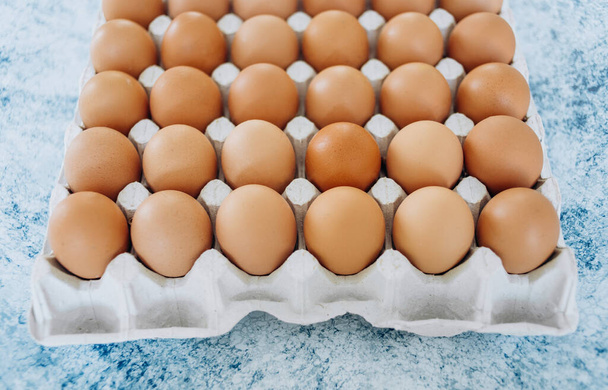 Close up of eggs in cardboard container - Photo, Image