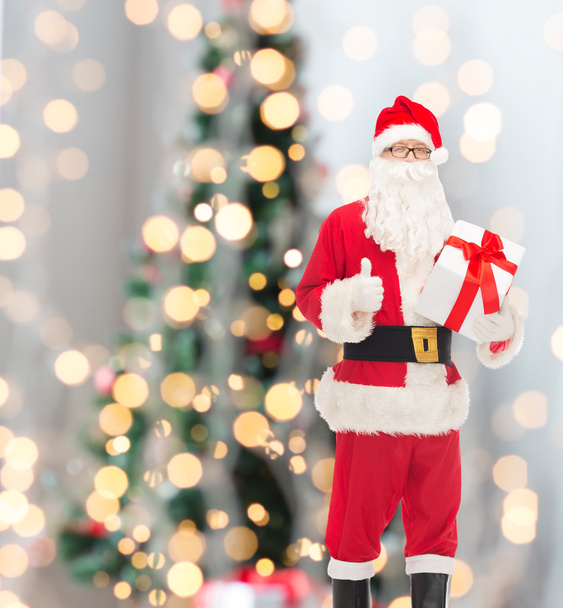 man in costume of santa claus with gift box - Photo, Image