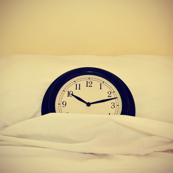 clock in bed, with a retro effect - Photo, Image